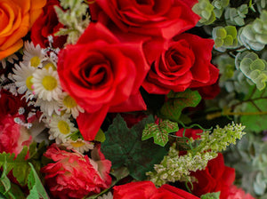 Red Carnation and Open Rose Bush